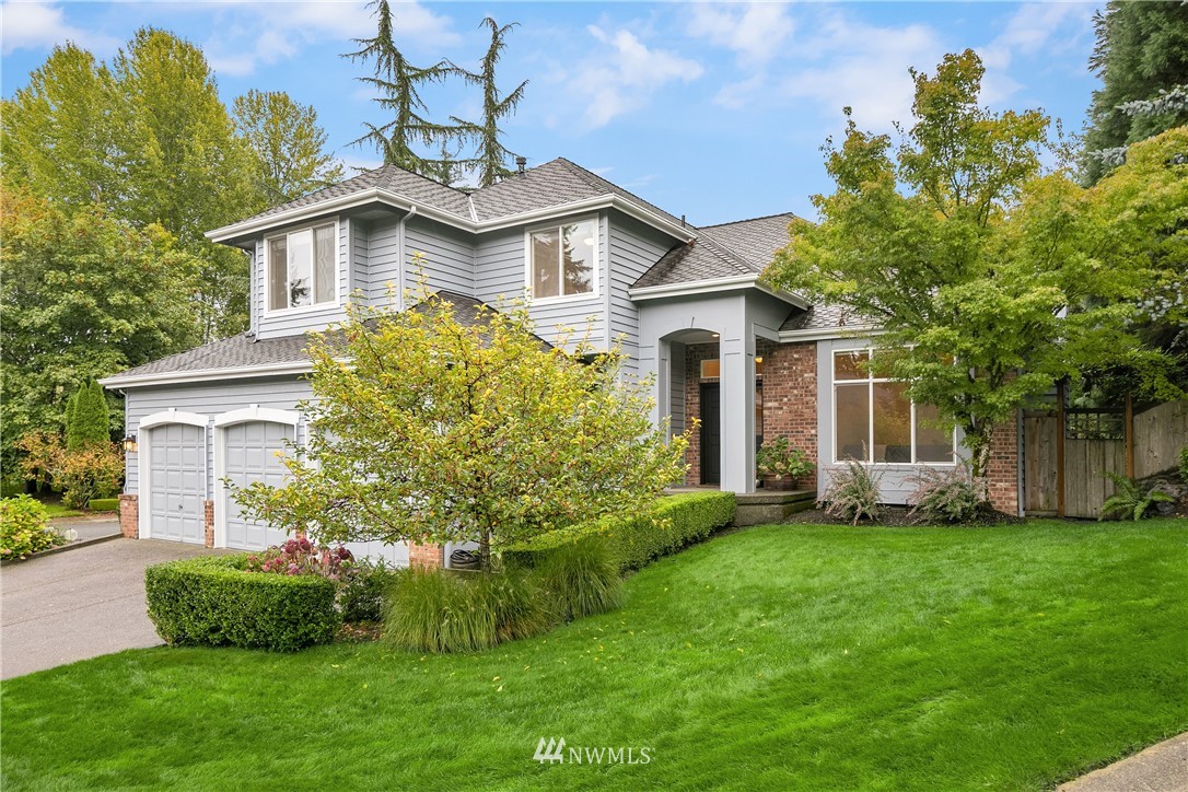 14633 Southeast 82nd Court Newcastle, WA 98059 - Photo 2 of 34 a front view of a house with a garden