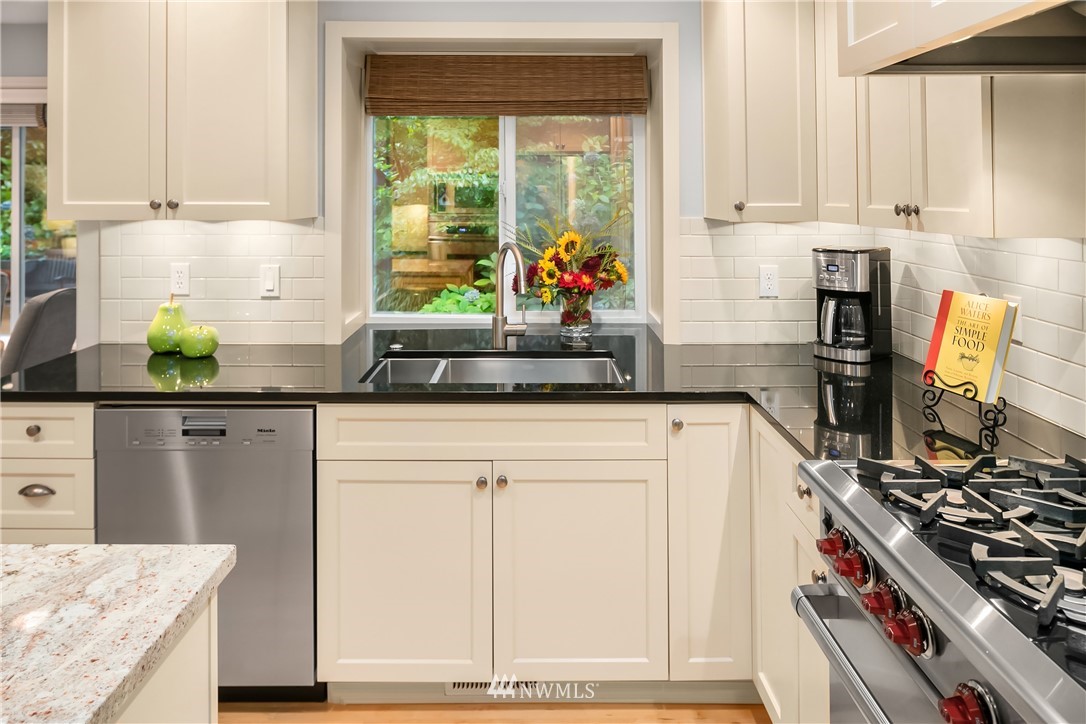 14633 Southeast 82nd Court Newcastle, WA 98059 - Photo 11 of 34 a kitchen with stainless steel appliances granite countertop a stove and a refrigerator