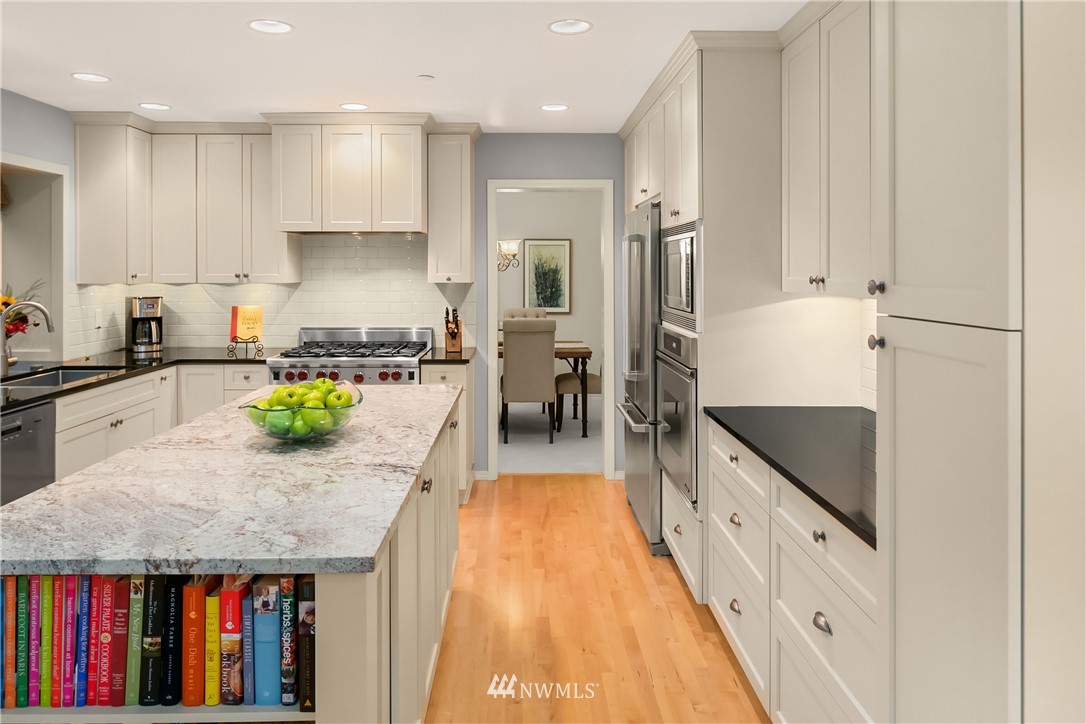 14633 Southeast 82nd Court Newcastle, WA 98059 - Photo 12 of 34 a kitchen with counter top space cabinets and stainless steel appliances