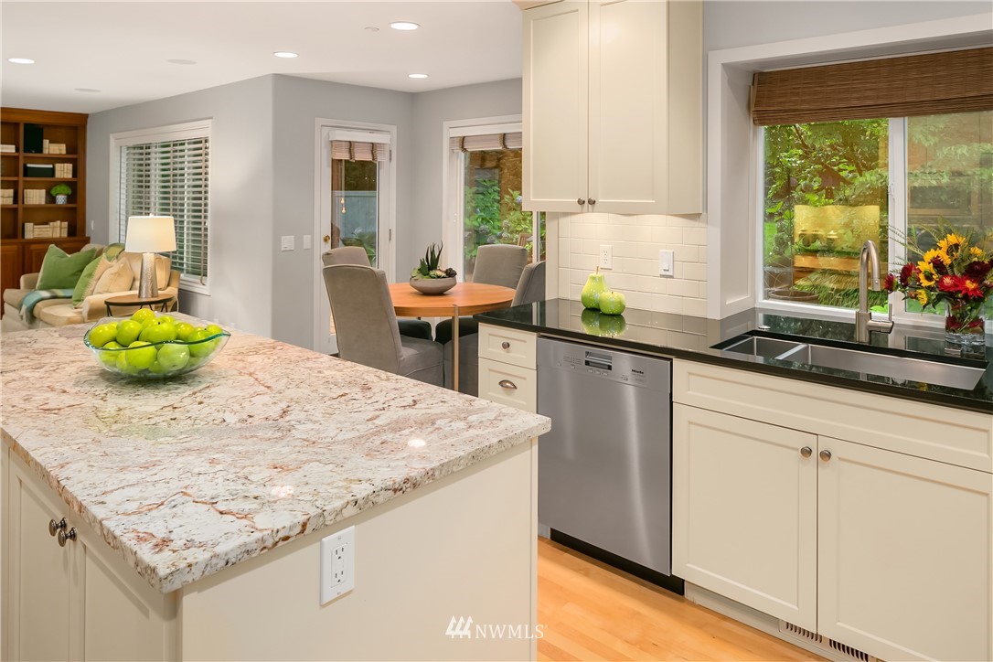 14633 Southeast 82nd Court Newcastle, WA 98059 - Photo 14 of 34 a kitchen with stainless steel appliances granite countertop a sink and a refrigerator