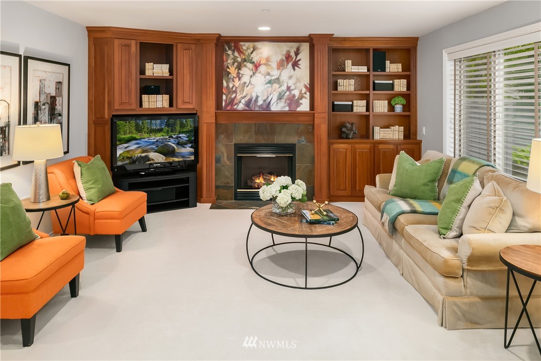14633 Southeast 82nd Court Newcastle, WA 98059 - Photo 16 of 34 a living room with furniture and a fireplace