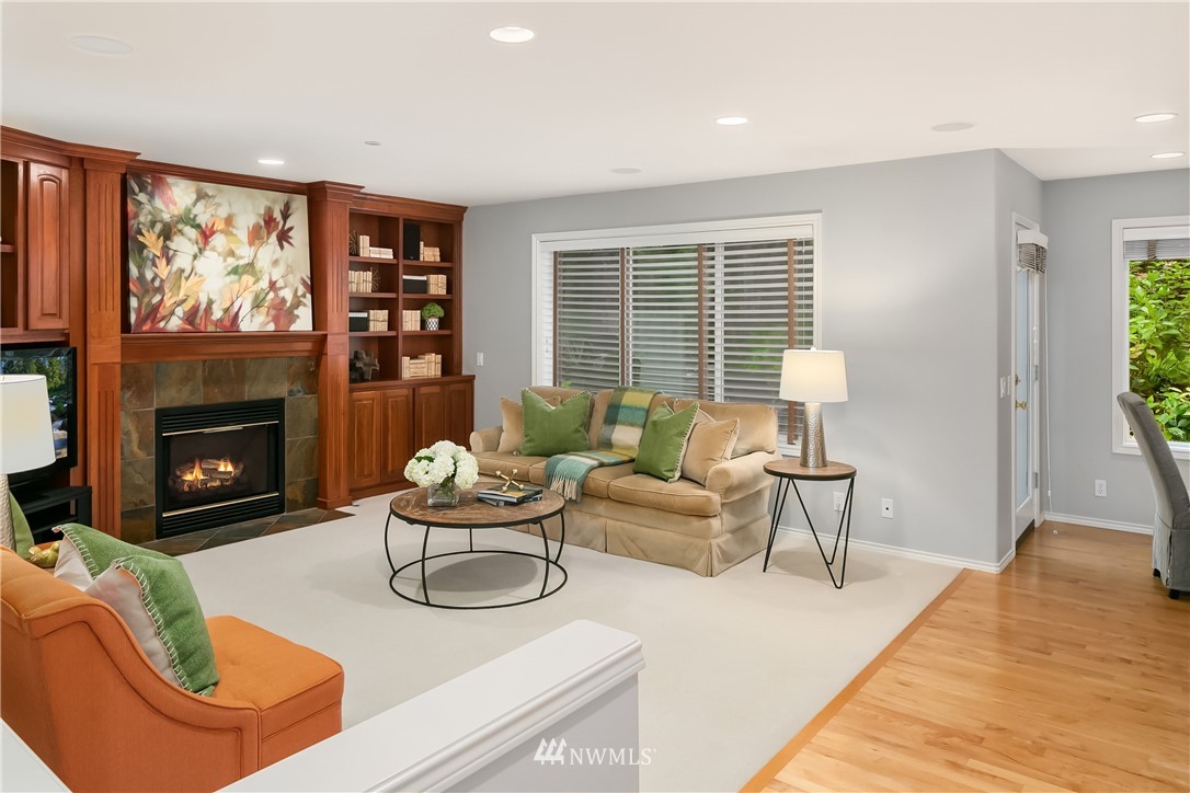14633 Southeast 82nd Court Newcastle, WA 98059 - Photo 17 of 34 a living room with furniture a fireplace and a large window