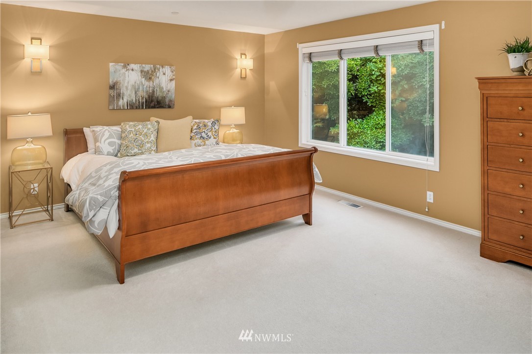 14633 Southeast 82nd Court Newcastle, WA 98059 - Photo 20 of 34 a bedroom with a bed and window