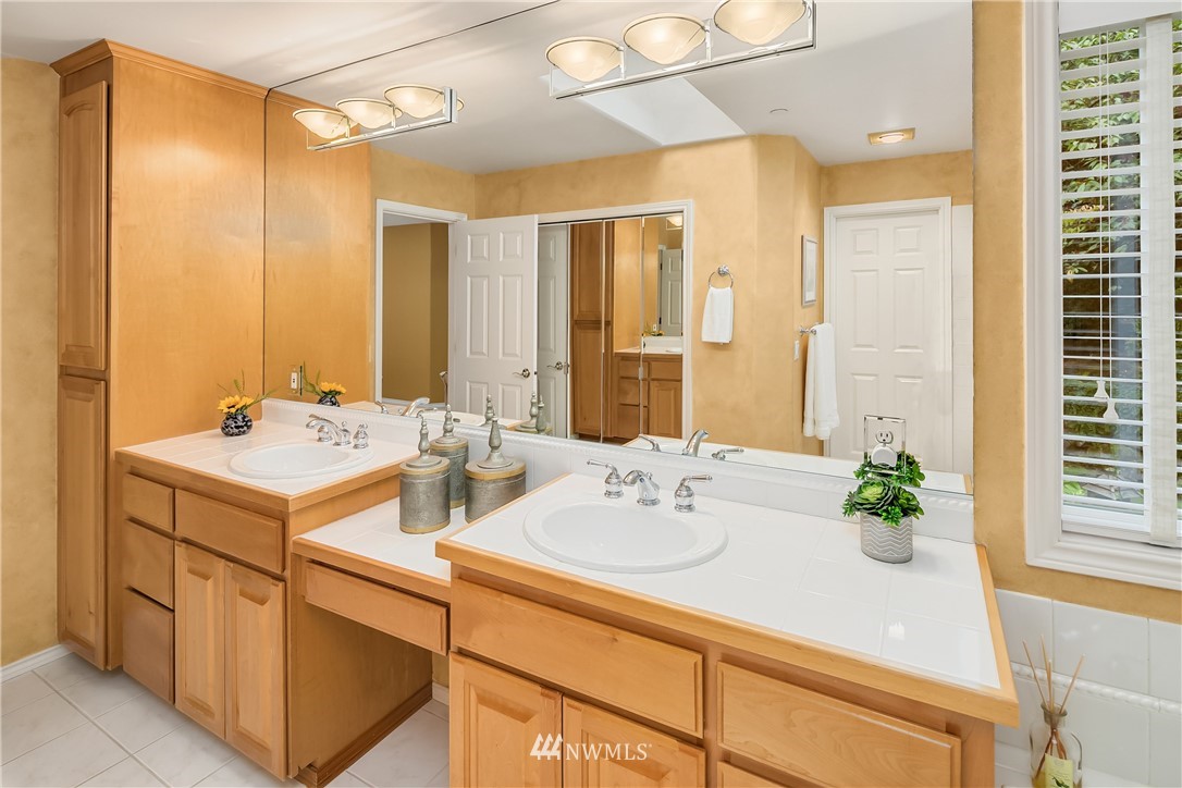14633 Southeast 82nd Court Newcastle, WA 98059 - Photo 21 of 34 a bathroom with a sink and a mirror