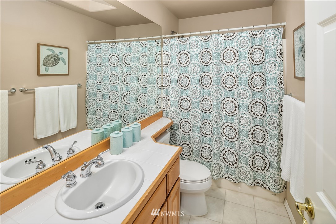 14633 Southeast 82nd Court Newcastle, WA 98059 - Photo 26 of 34 a bathroom with a toilet sink and mirror