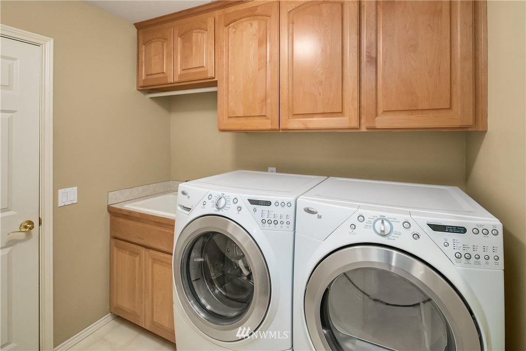 14633 Southeast 82nd Court Newcastle, WA 98059 - Photo 27 of 34 a utility room with dryer and washer