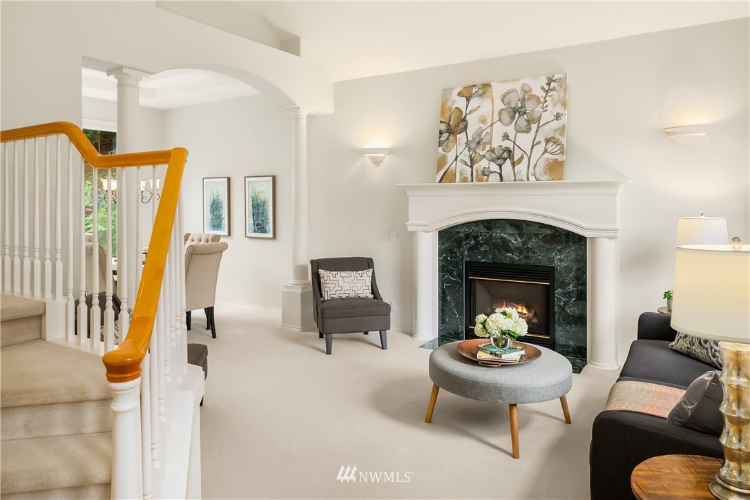 14633 Southeast 82nd Court Newcastle, WA 98059 - Photo 4 of 34 a living room with furniture and a fireplace