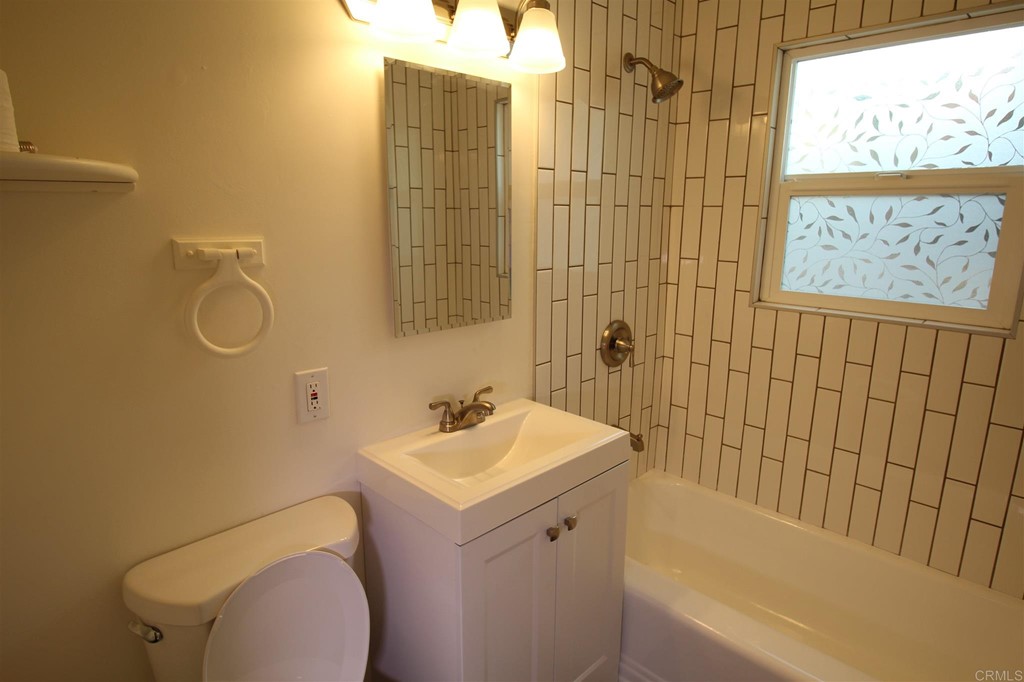 1201 Pepper Drive El Cajon, CA 92021 - Photo 11 of 15 a bathroom with a sink a toilet and shower