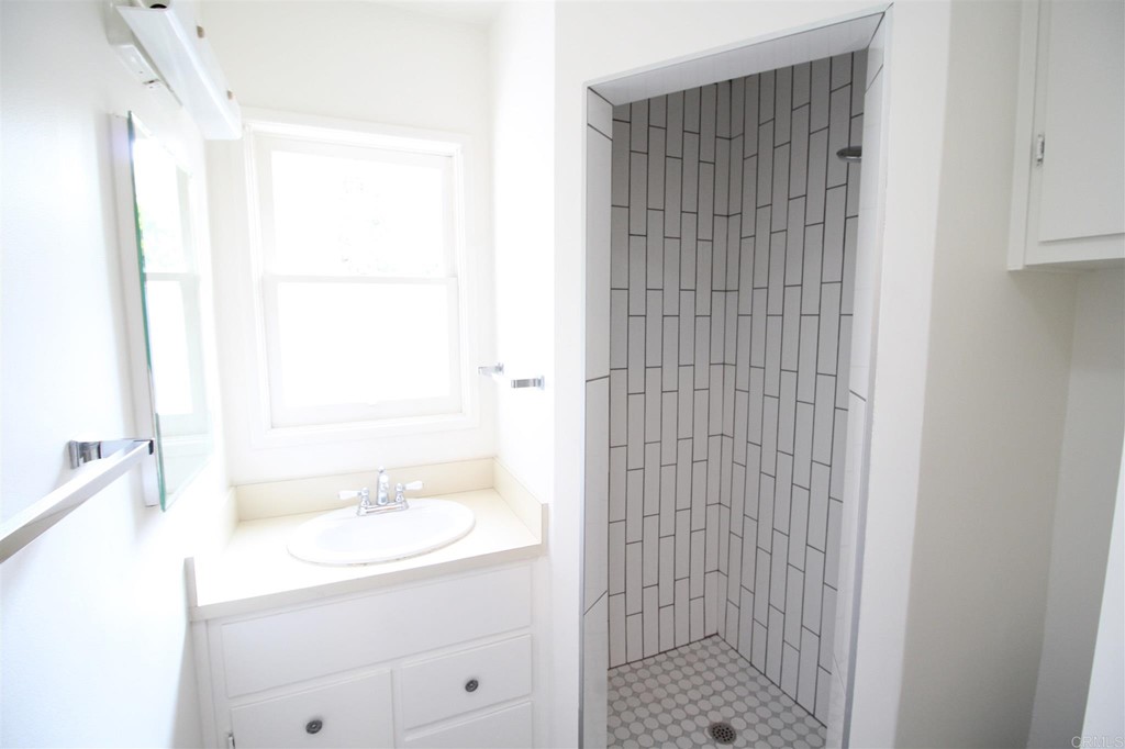 1201 Pepper Drive El Cajon, CA 92021 - Photo 12 of 15 a bathroom with a shower and a sink
