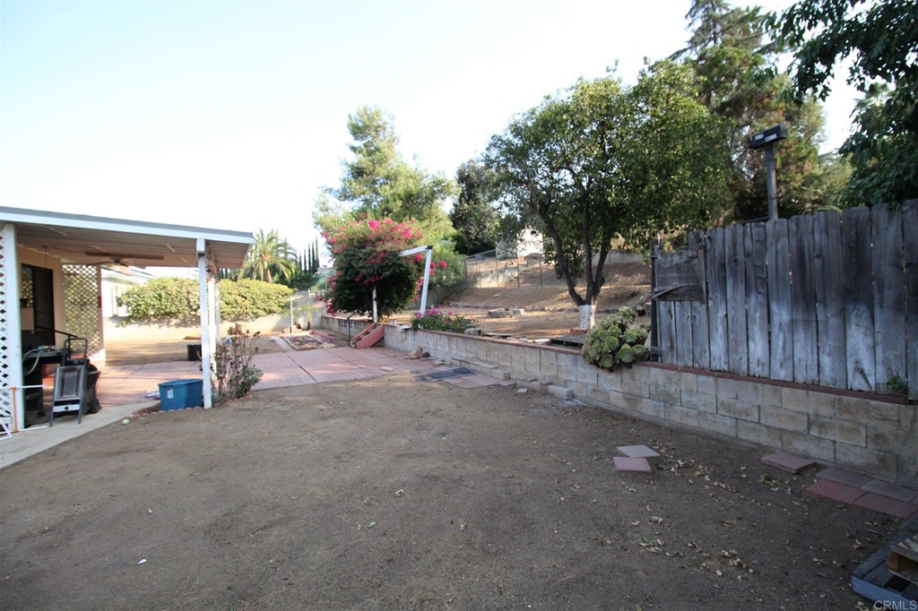 1201 Pepper Drive El Cajon, CA 92021 - Photo 14 of 15 a view of a backyard with a large tree