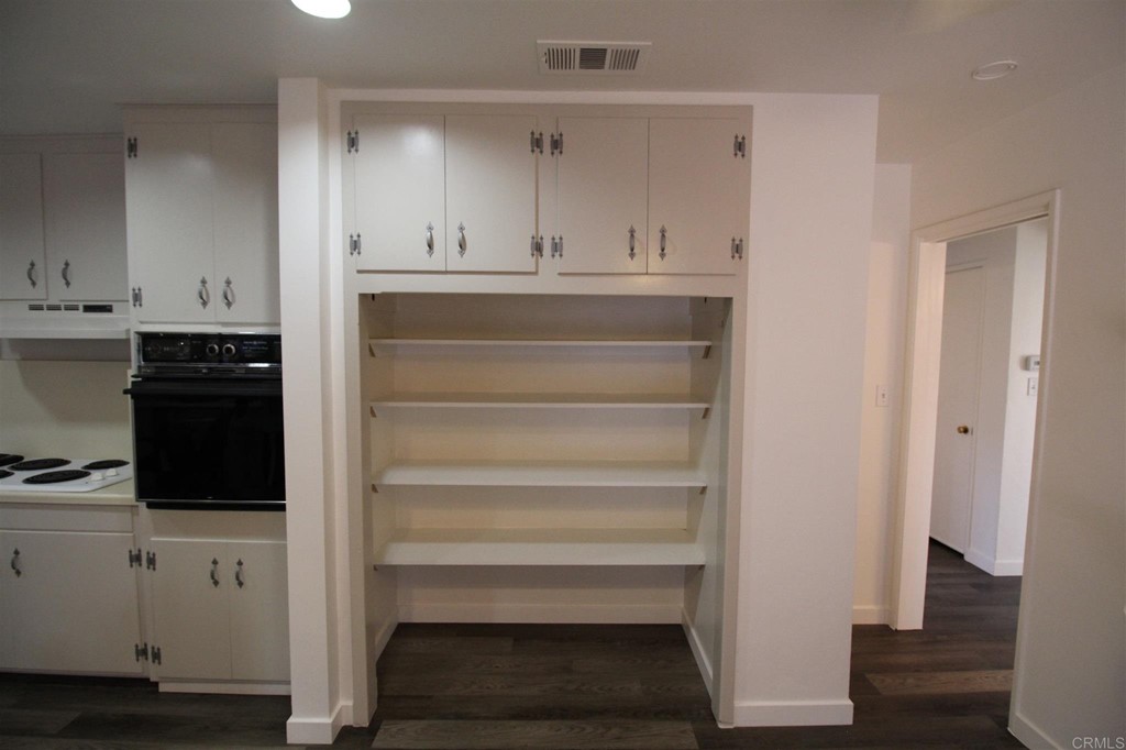 1201 Pepper Drive El Cajon, CA 92021 - Photo 6 of 15 a view of cabinets and wooden floor