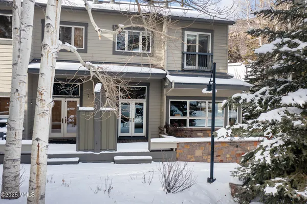 a view of a patio with iron fence