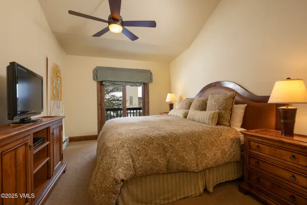 a bathroom with a double vanity sink mirror and shower