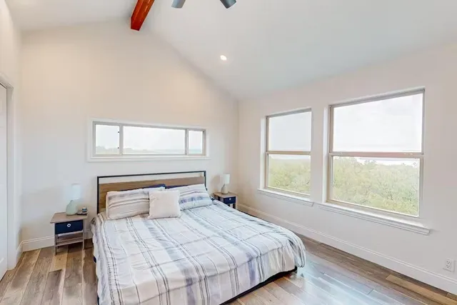 a kitchen with granite countertop a sink and a refrigerator