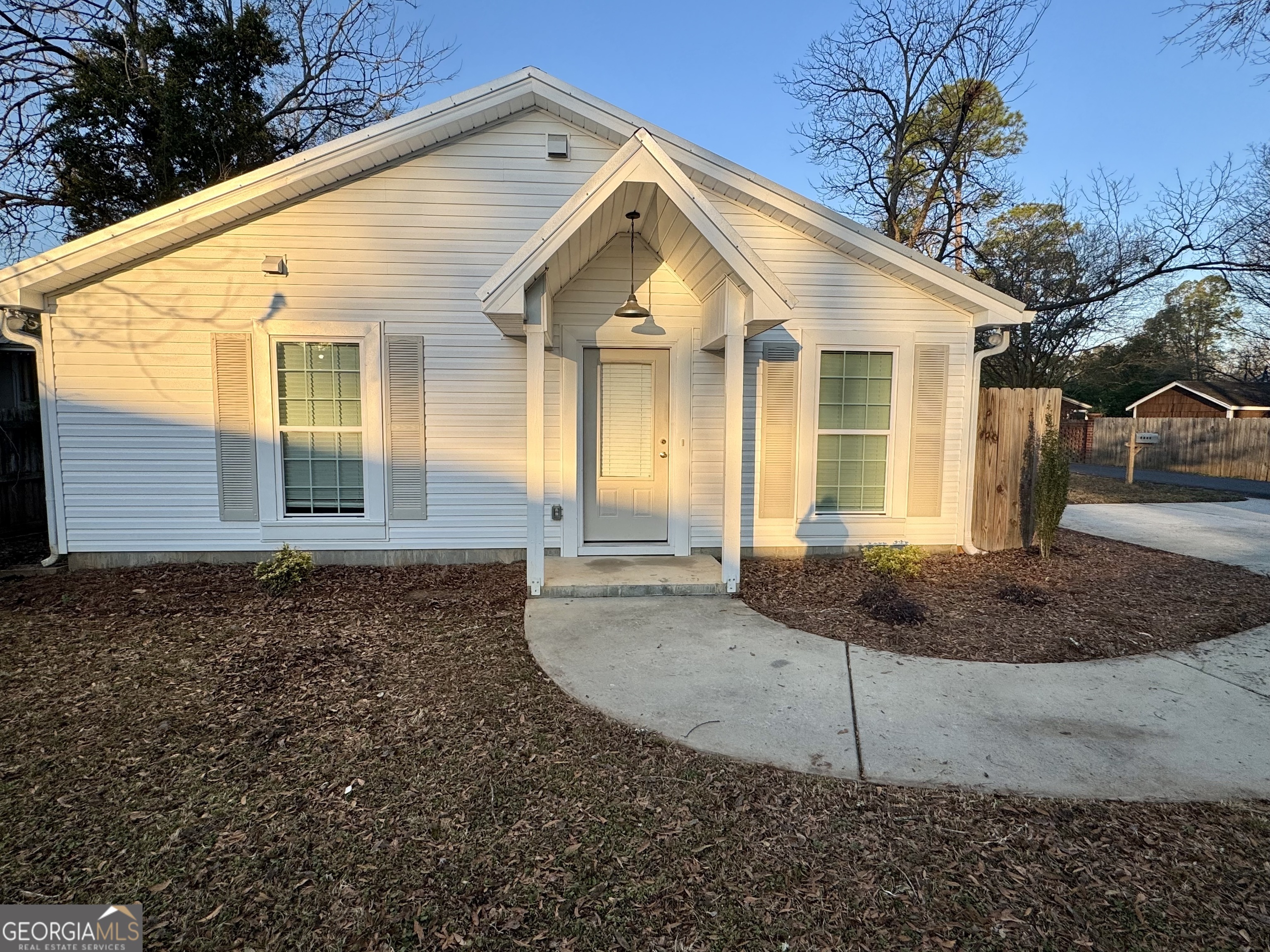 1112 3rd Street, Unit B Perry, GA 31069 - Photo 1 of 11 a front view of a house