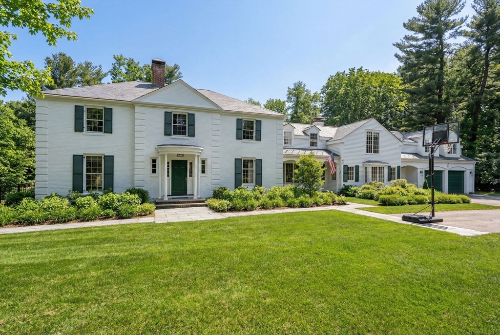 389 Grove Street Needham, MA 02492 - Photo 1 of 40 a front view of a house with a yard