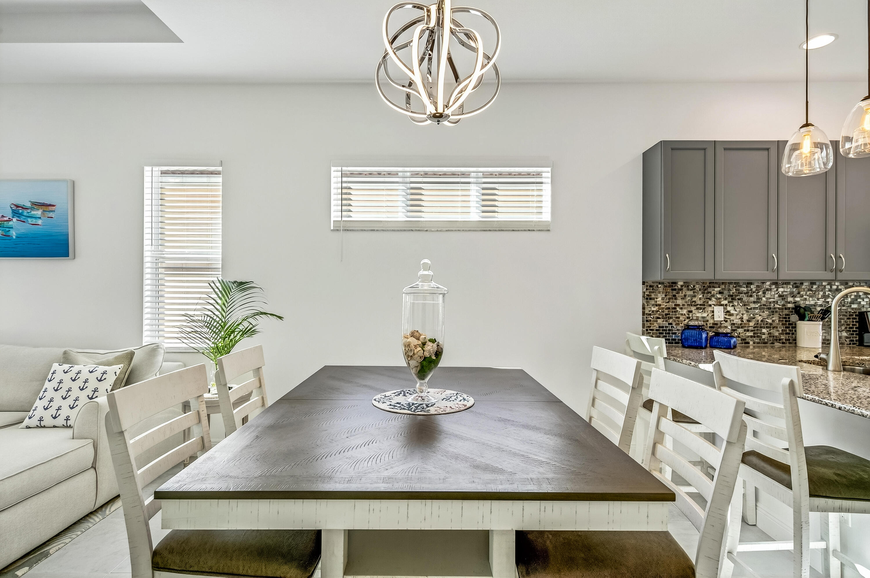 11461 Southwest Visconti Way Port St. Lucie, FL 34986 - Photo 16 of 32 a kitchen with a table and chairs in it