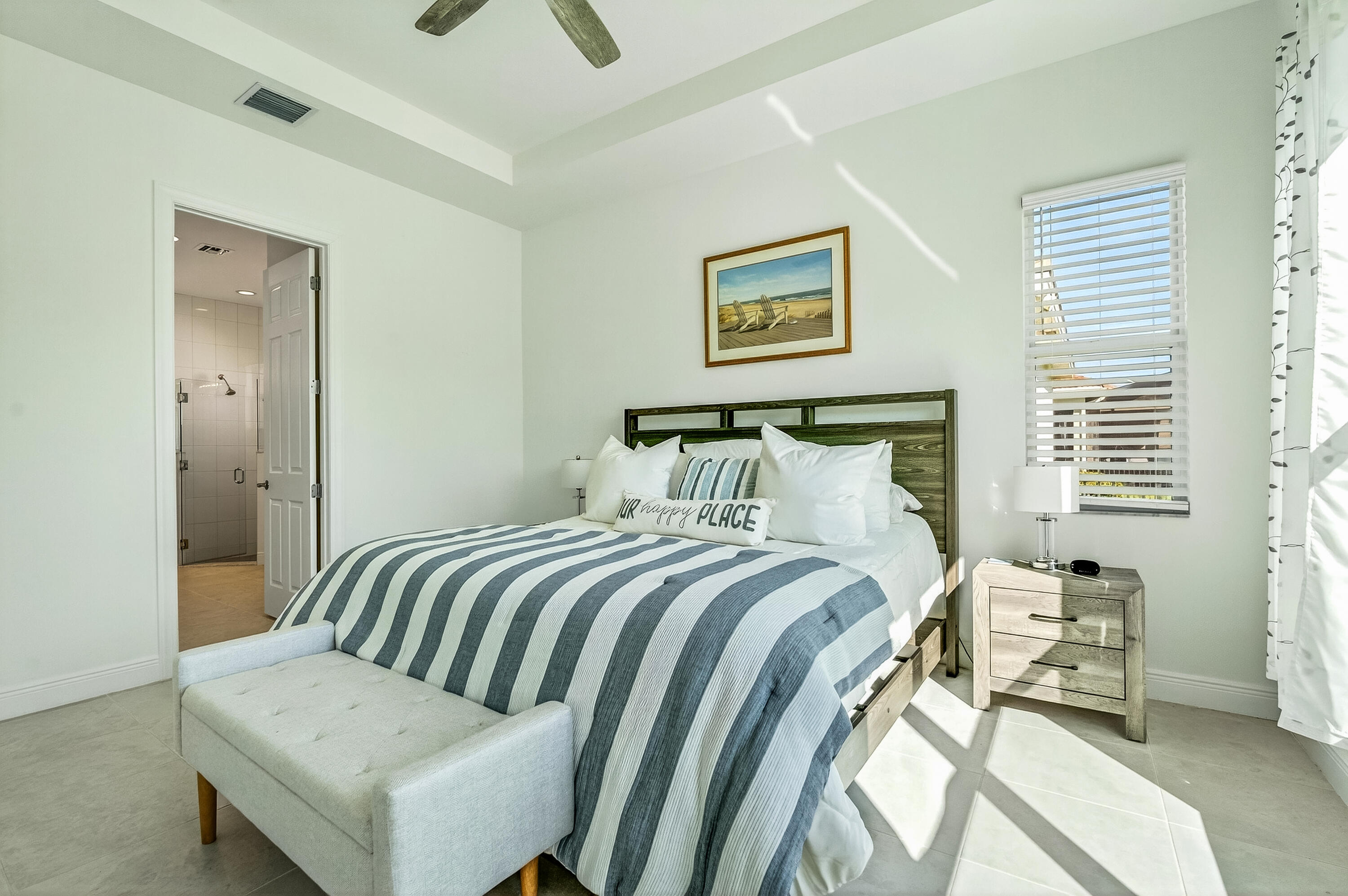 11461 Southwest Visconti Way Port St. Lucie, FL 34986 - Photo 19 of 32 a bedroom with a bed and a couch