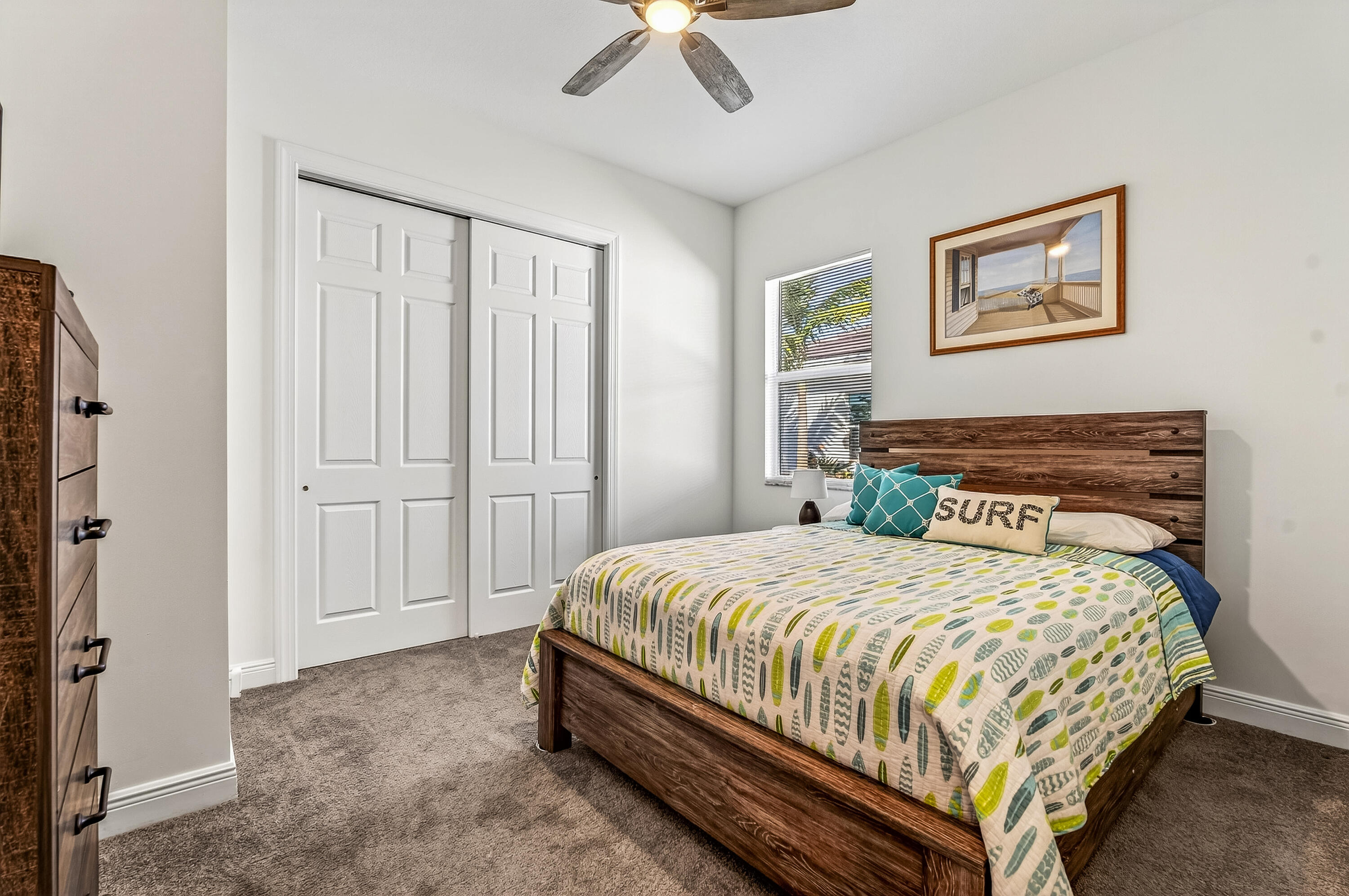 11461 Southwest Visconti Way Port St. Lucie, FL 34986 - Photo 24 of 32 a bedroom with a bed and a chandelier