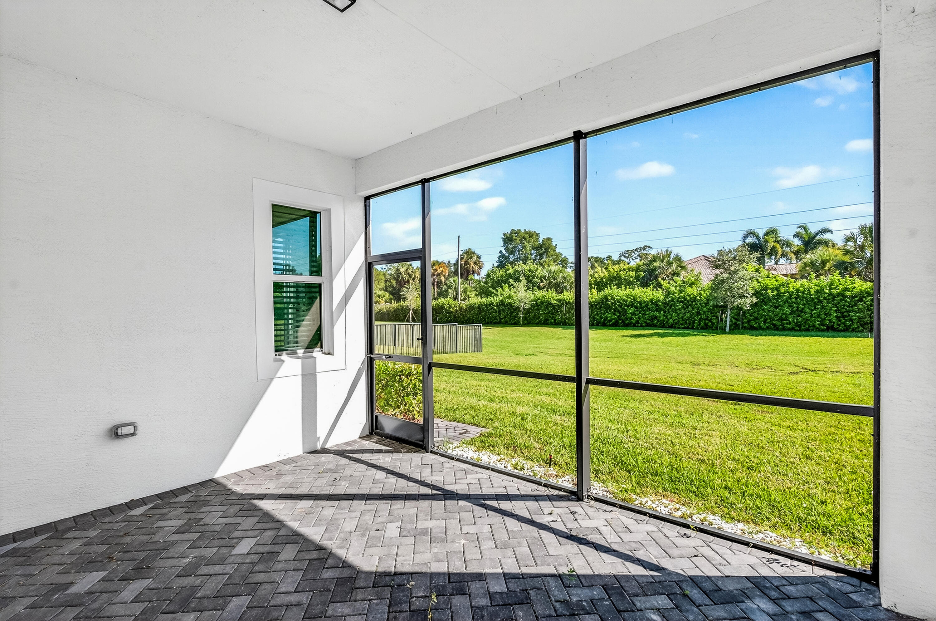 11461 Southwest Visconti Way Port St. Lucie, FL 34986 - Photo 27 of 32 a view of a garden from a living room