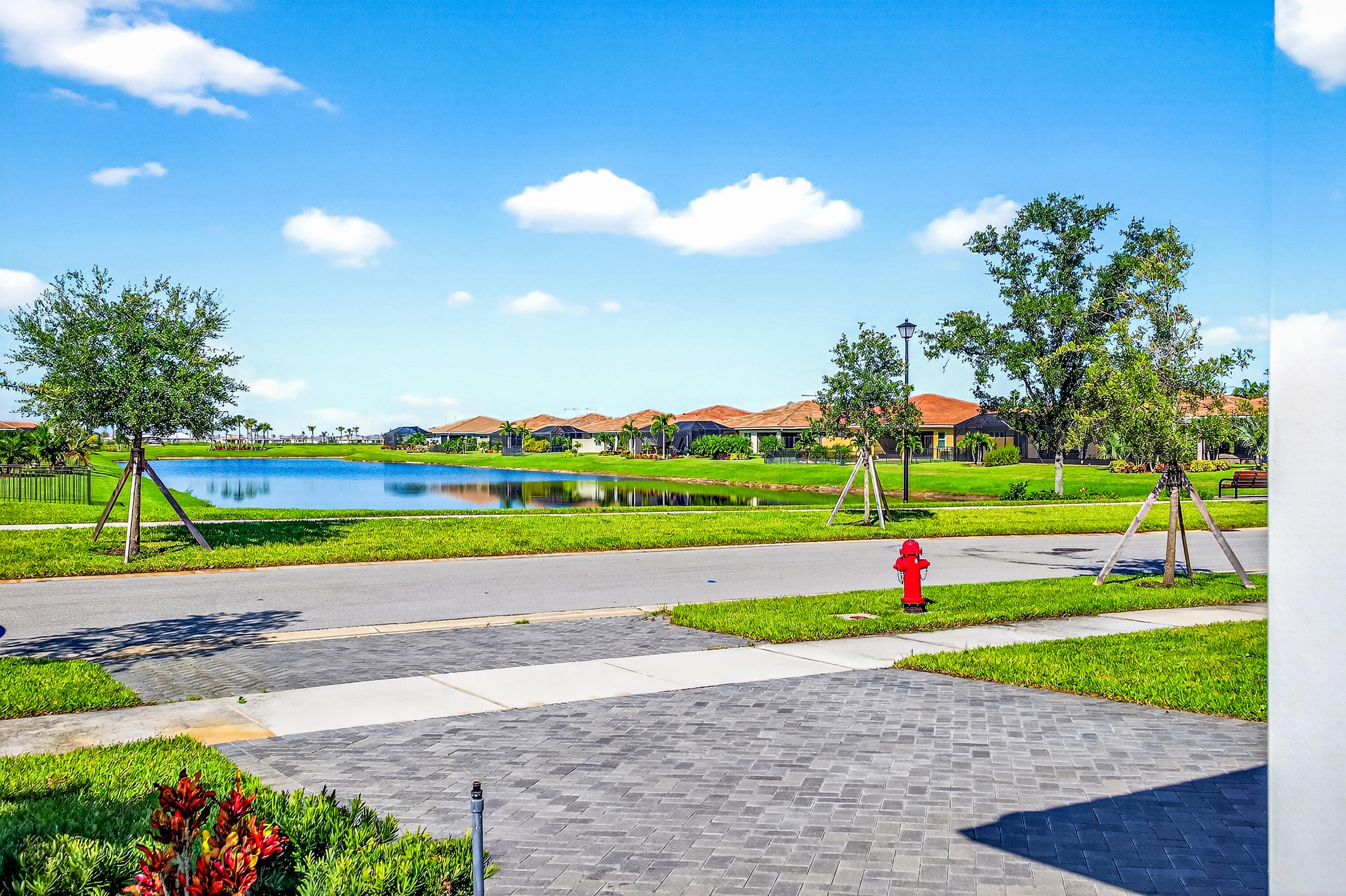 11461 Southwest Visconti Way Port St. Lucie, FL 34986 - Photo 3 of 32 a view of a play ground in front of a house with a yard