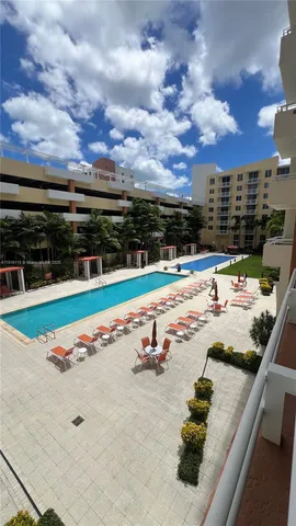 a view of swimming pool with outdoor seating