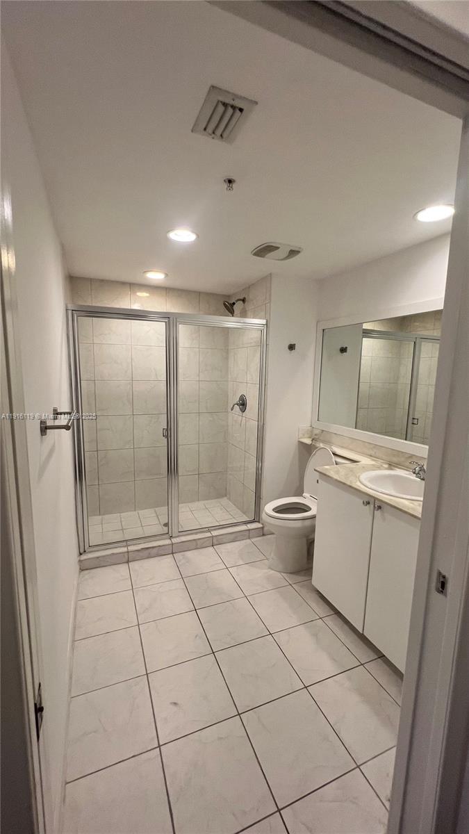 2775 Northeast 187th Street, Unit 227 Aventura, FL 33180 - Photo 11 of 17 a bathroom with a sink mirror and toilet
