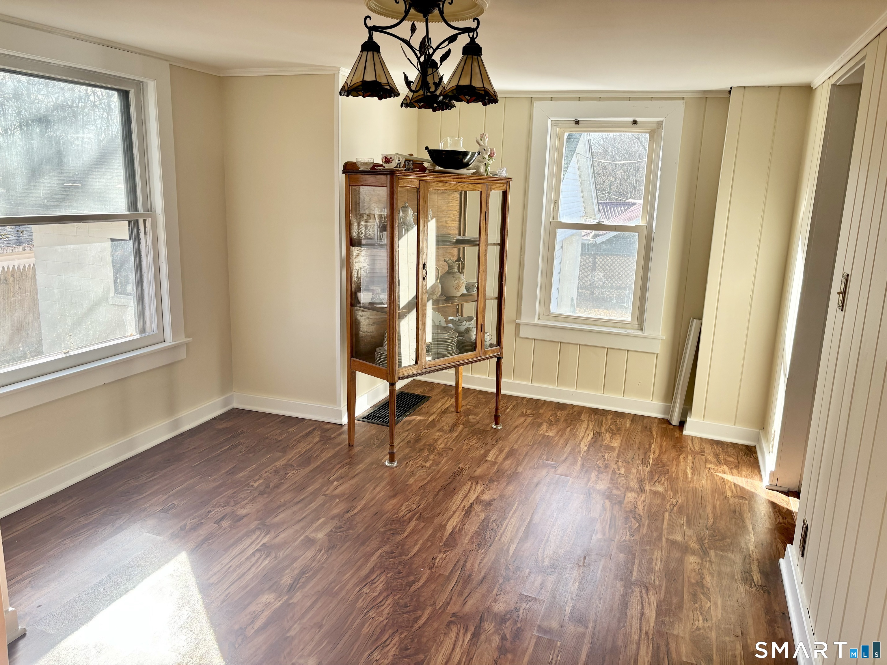 336 Reservoir Avenue Meriden, CT 06451 - Photo 11 of 17 an empty room with wooden floor and windows