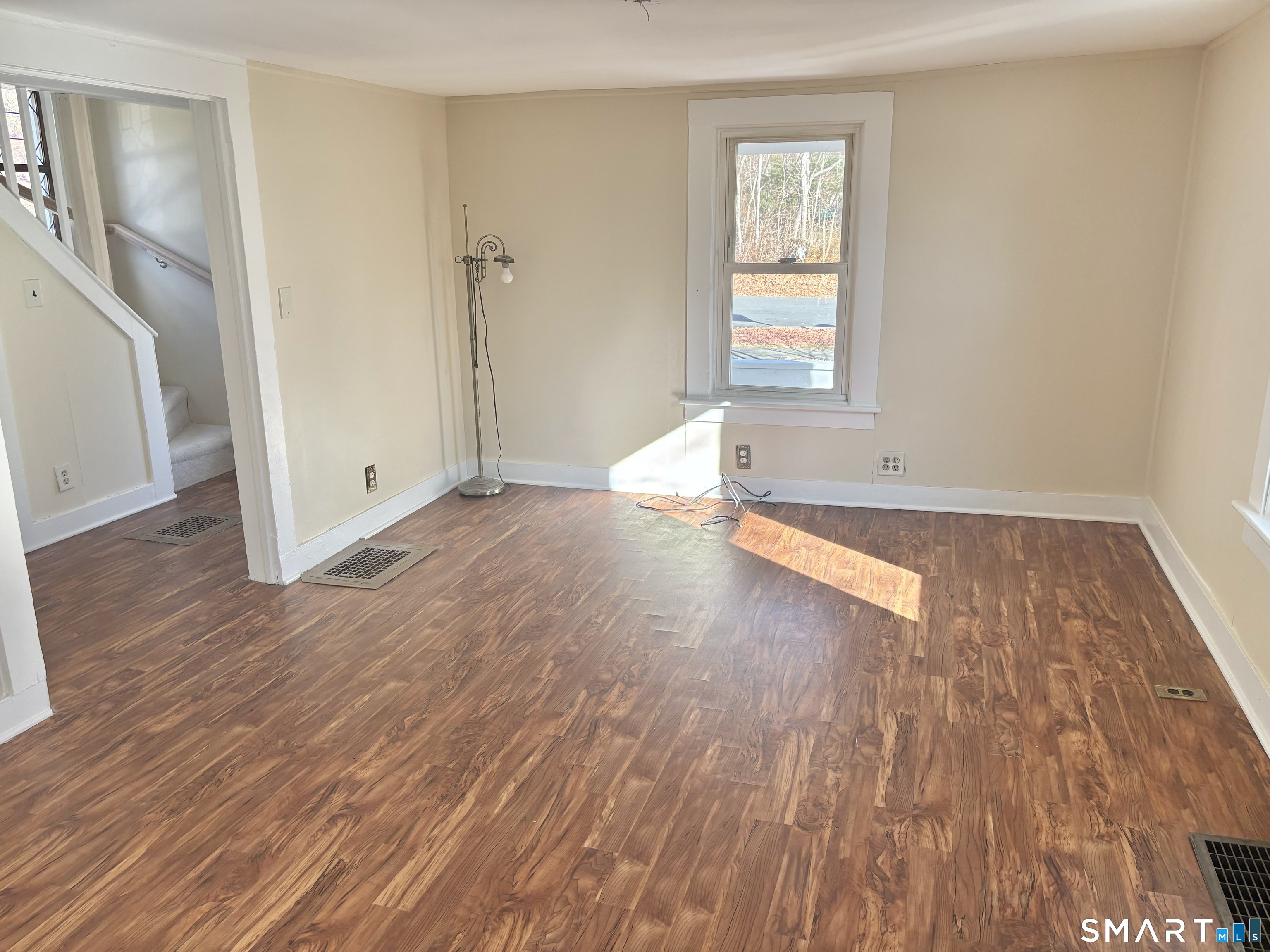 336 Reservoir Avenue Meriden, CT 06451 - Photo 12 of 17 an empty room with wooden floor and windows