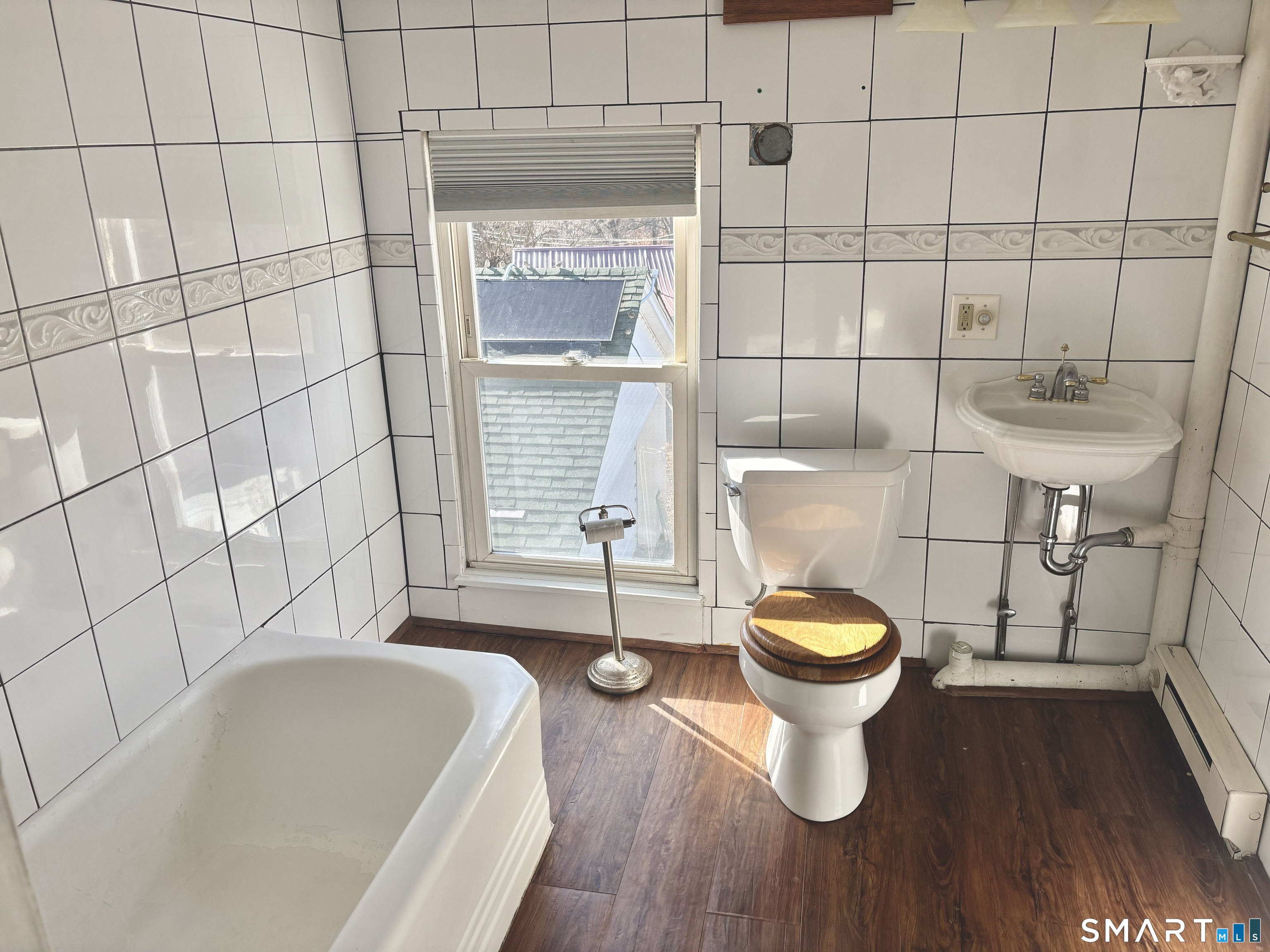 336 Reservoir Avenue Meriden, CT 06451 - Photo 15 of 17 a bathroom with a sink and a toilet