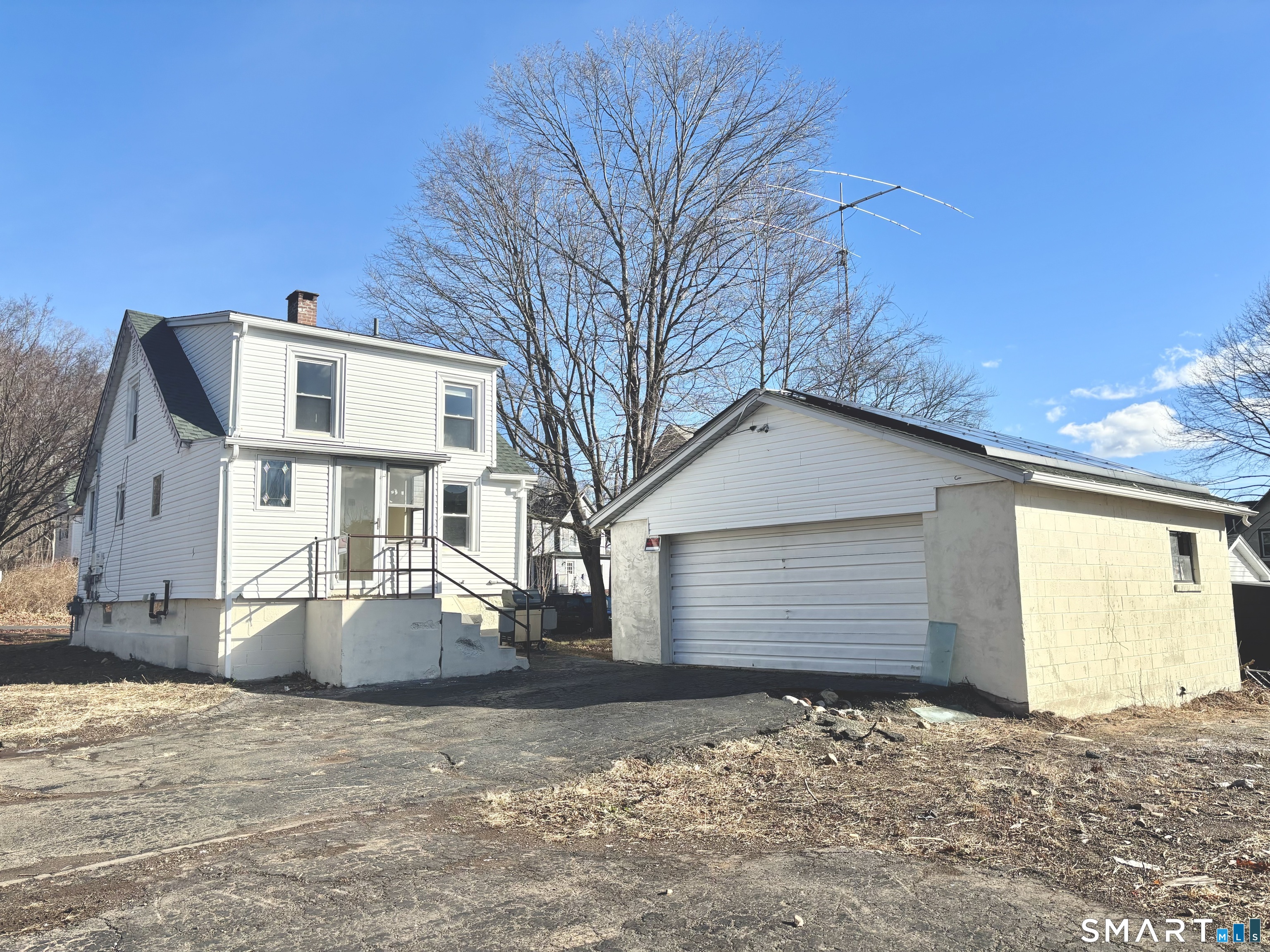 336 Reservoir Avenue Meriden, CT 06451 - Photo 3 of 17 a front view of a house with a yard and garage