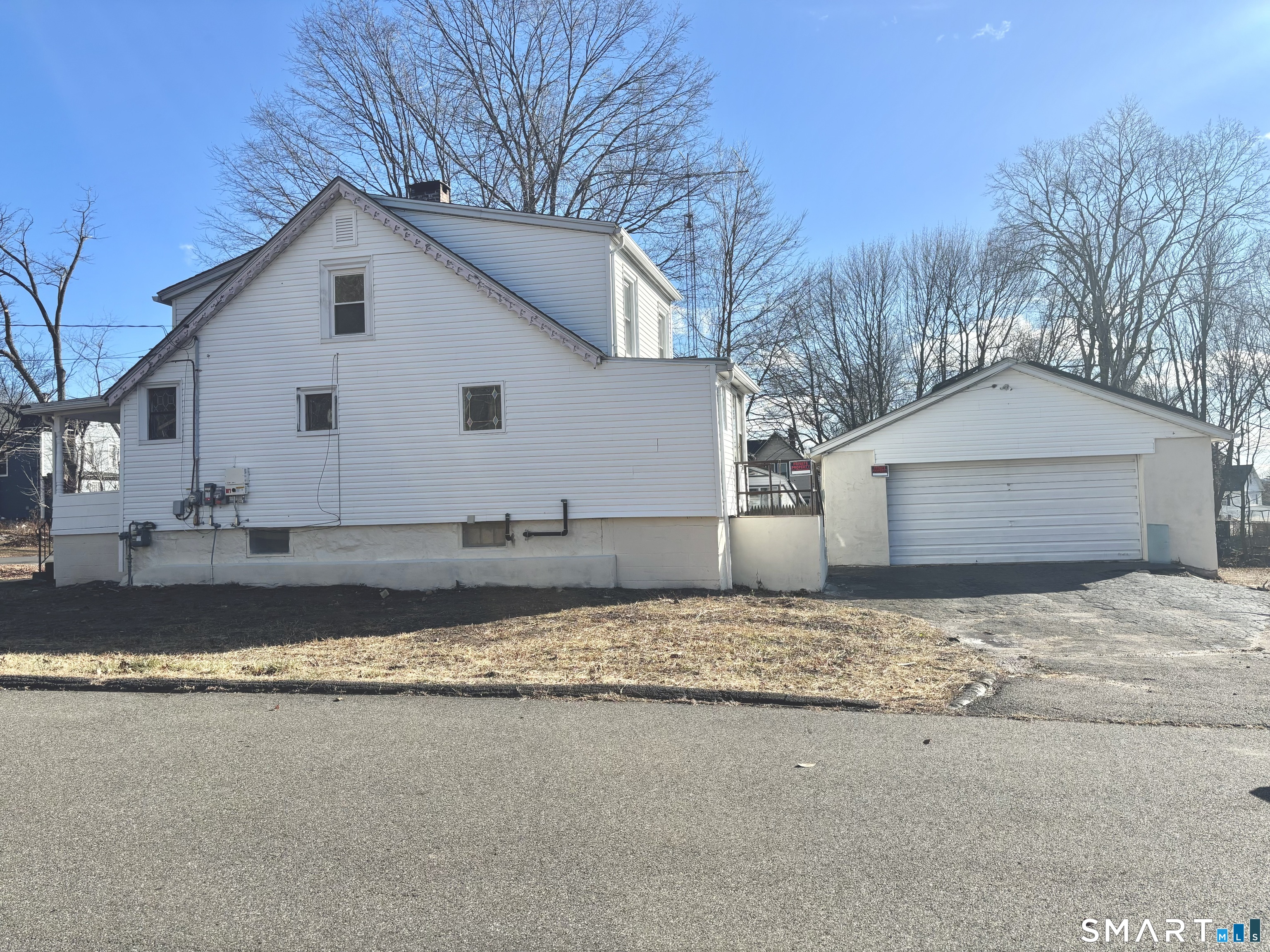 336 Reservoir Avenue Meriden, CT 06451 - Photo 5 of 17 a view of a house with a yard covered in snow
