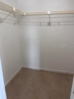 a view of a room with racks on the wall