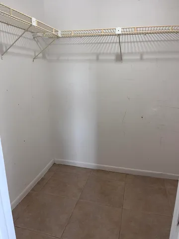 a view of a room with racks on the wall