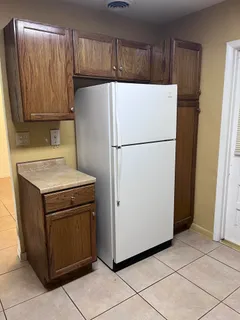 a white refrigerator freezer sitting in a kitchen