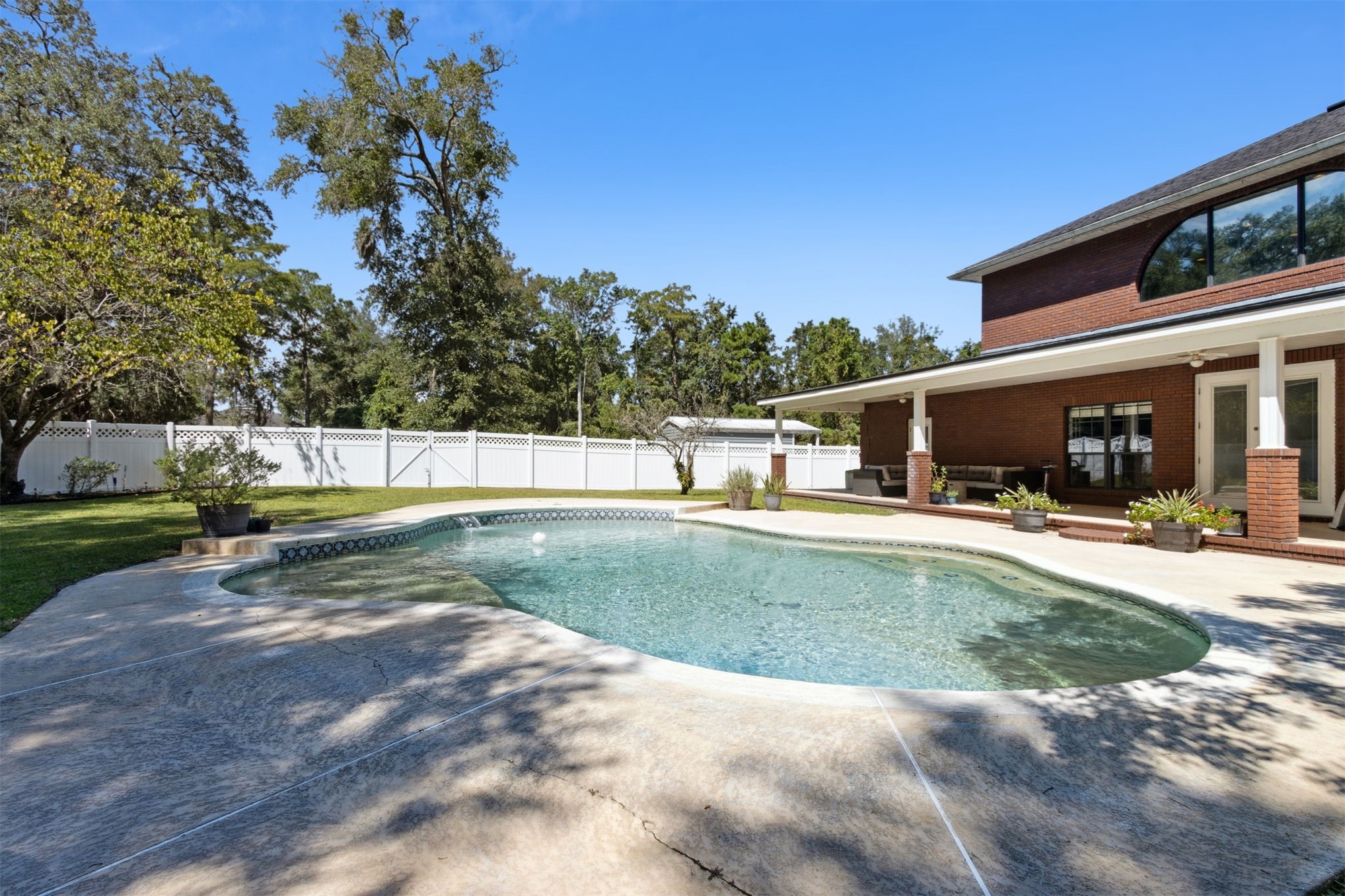 87377 Raddin Road Yulee, FL 32097 - Photo 65 of 75 a view of a swimming pool with a patio