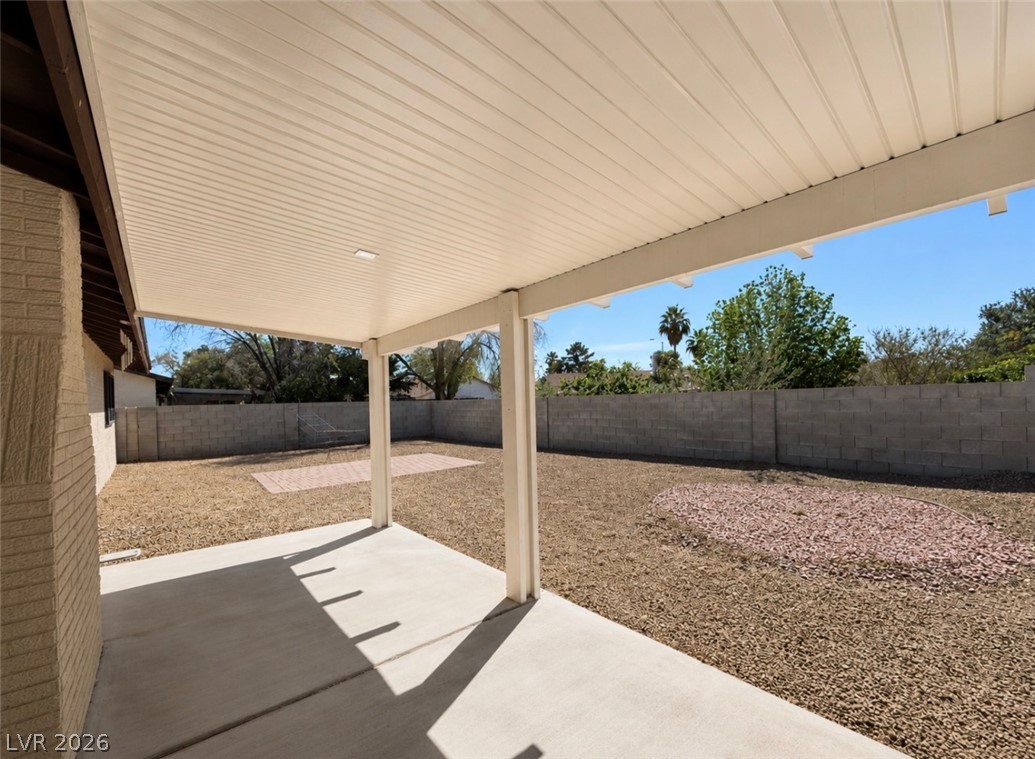 6491 West Viking Road Las Vegas, NV 89103 - Photo 4 of 5 A spacious covered patio provides comfortable outdoor living and ample backyard space.