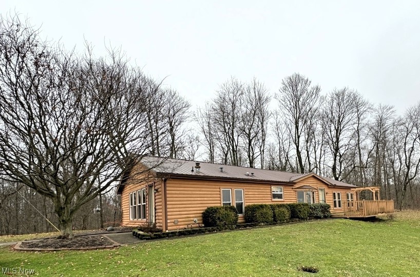 1357 Sand Ridge Road Zanesville, OH 43701 - Photo 1 of 50 Rear view of property featuring a yard and a wooden deck