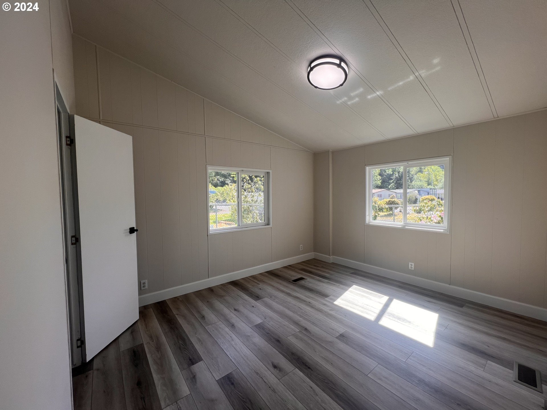 100 River Bend Road, Unit 4 Reedsport, OR 97467 - Photo 25 of 39 a view of an empty room and window
