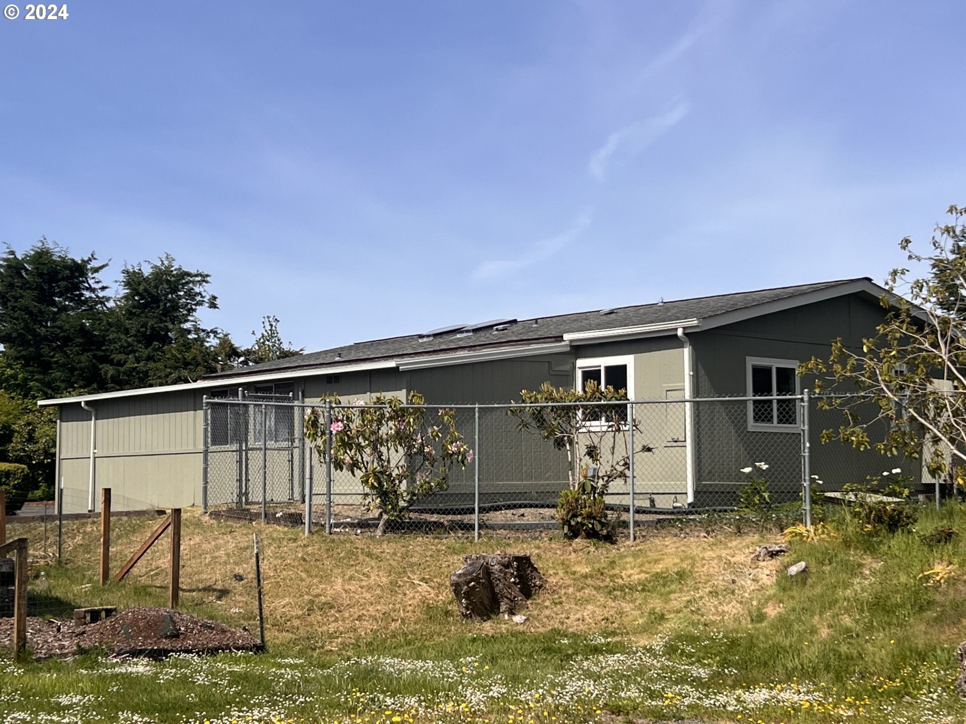 100 River Bend Road, Unit 4 Reedsport, OR 97467 - Photo 36 of 39 a view of a house with backyard