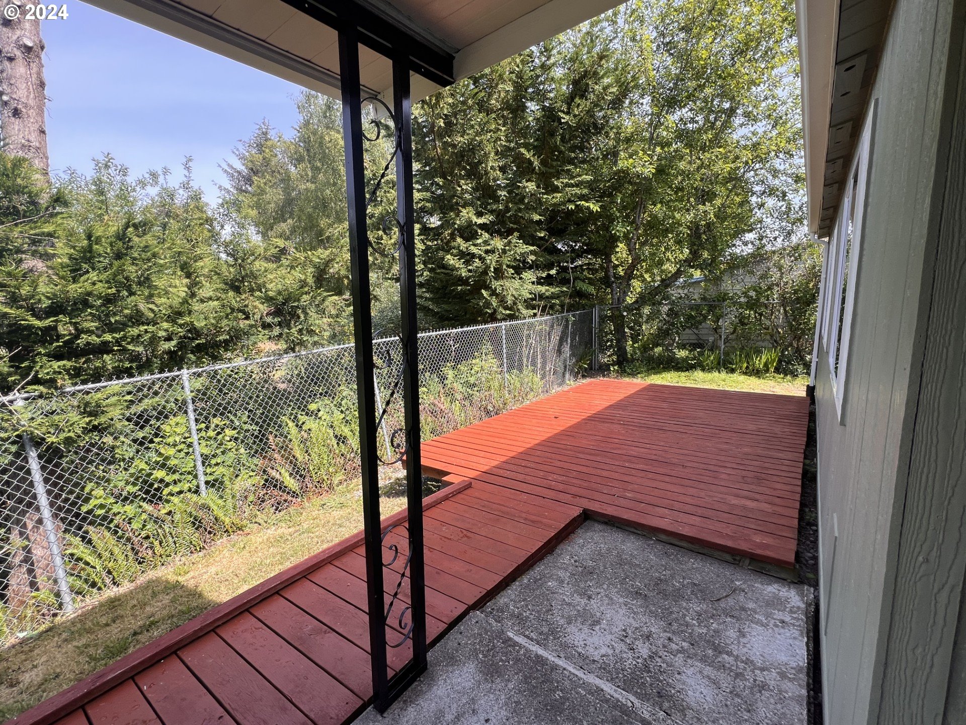 100 River Bend Road, Unit 4 Reedsport, OR 97467 - Photo 4 of 39 a view of a balcony with yard