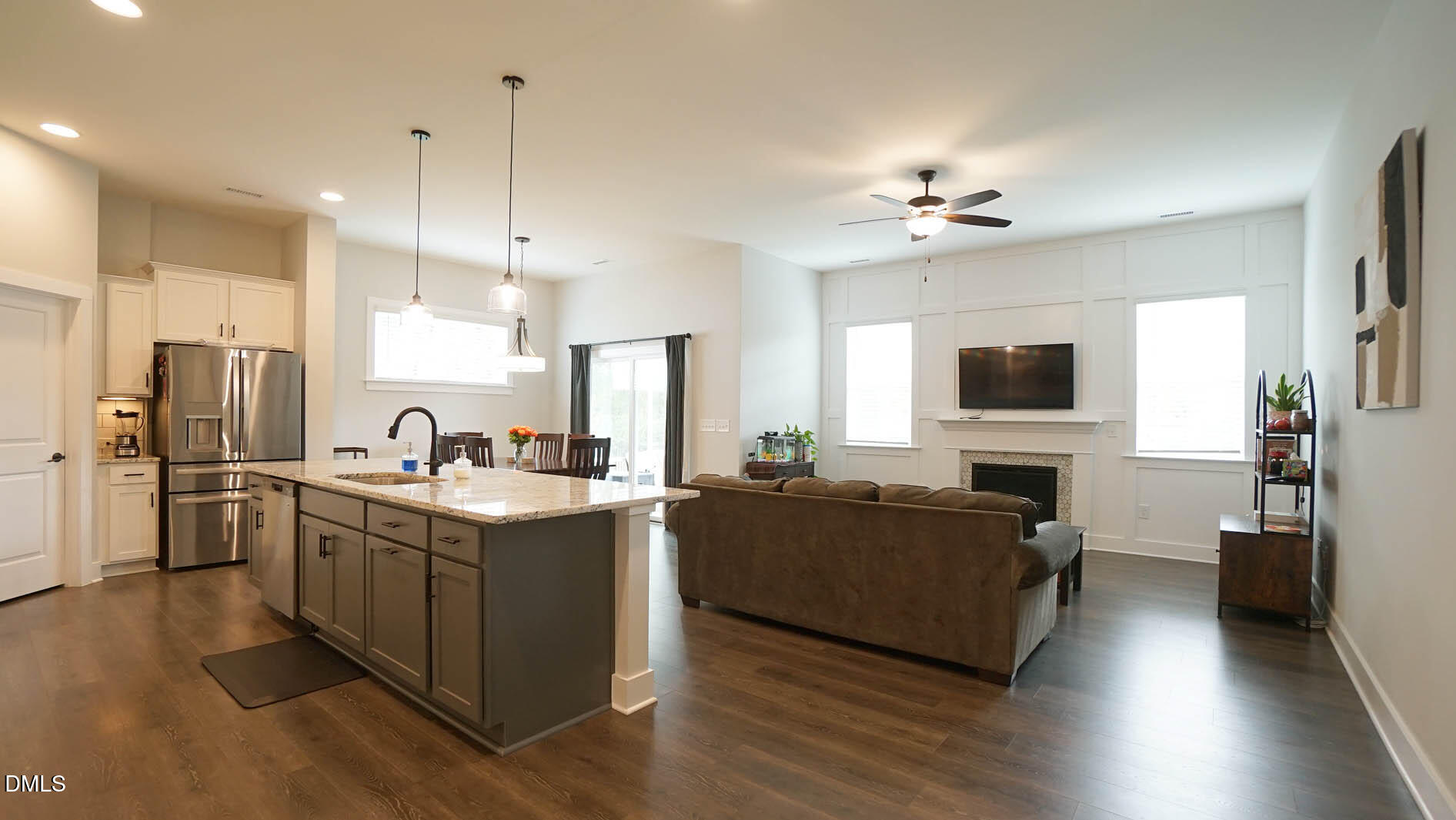 693 South Wilma Street Angier, NC 27501 - Photo 12 of 51 a kitchen with stainless steel appliances granite countertop a sink stove and refrigerator