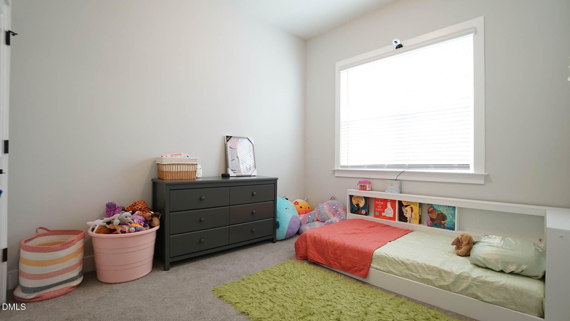 693 South Wilma Street Angier, NC 27501 - Photo 25 of 51 a bedroom with a bed and a window
