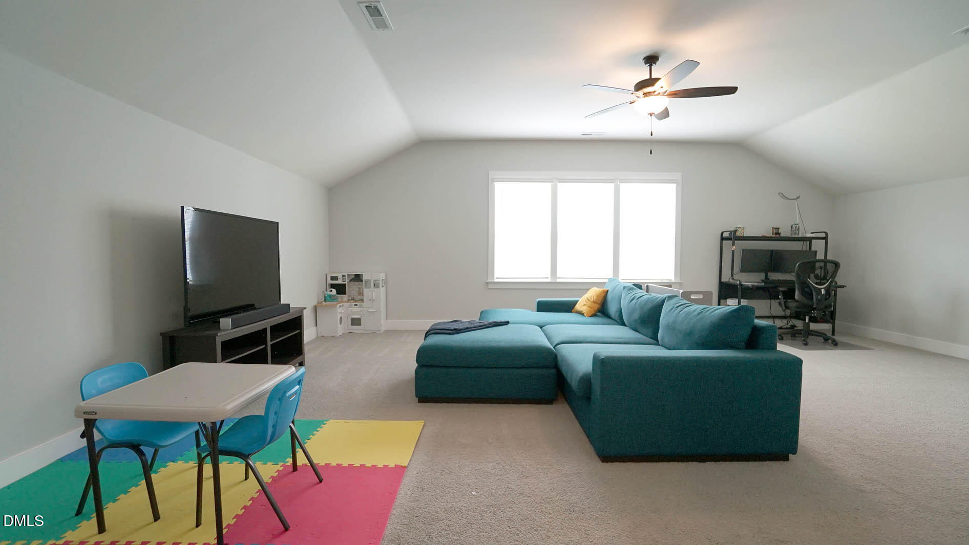 693 South Wilma Street Angier, NC 27501 - Photo 28 of 51 a living room with furniture and a flat screen tv