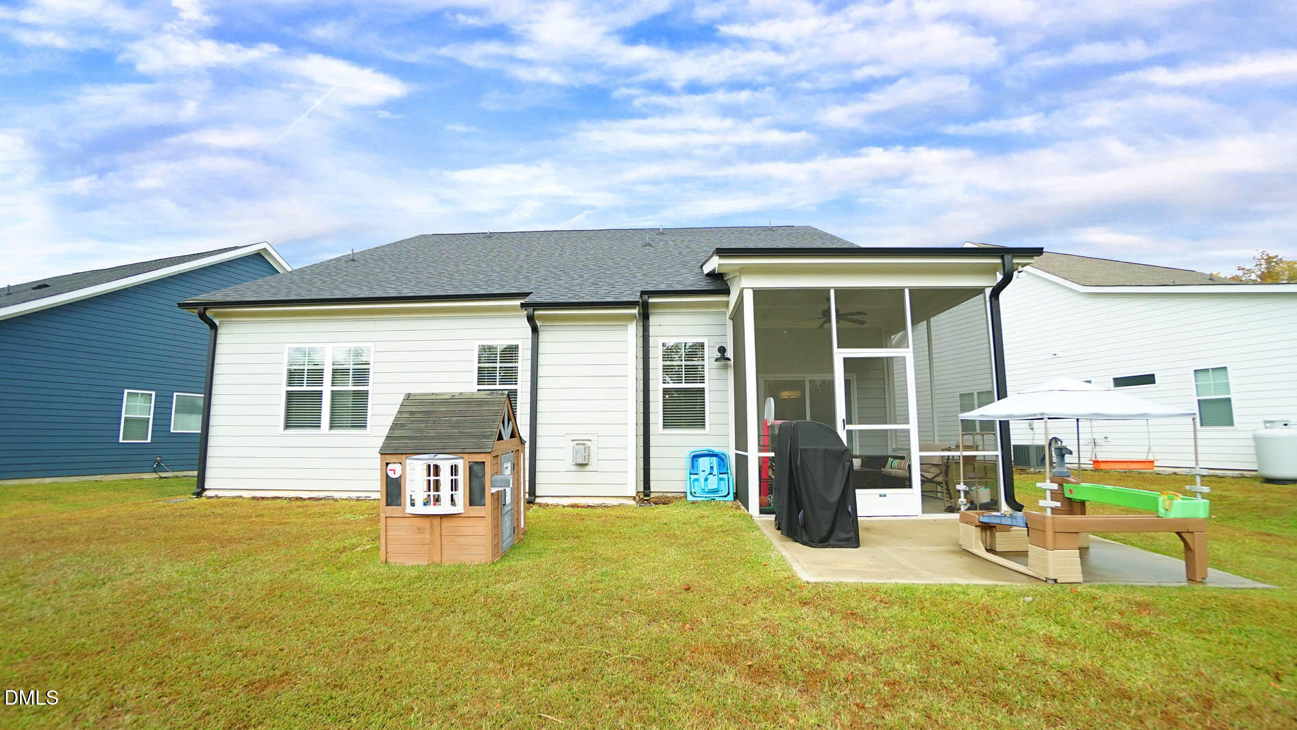 693 South Wilma Street Angier, NC 27501 - Photo 39 of 51 a view of a house with backyard porch and sitting area