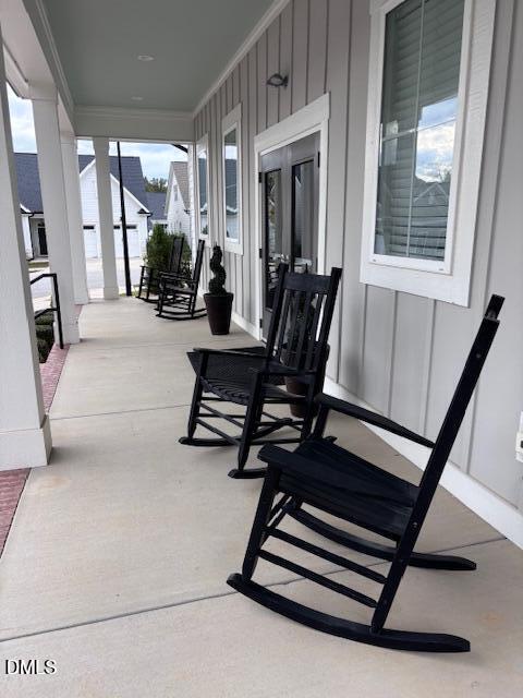 693 South Wilma Street Angier, NC 27501 - Photo 44 of 51 a view of hall with wooden floor and windows