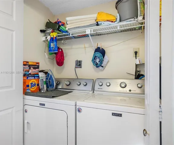 a utility room with dryer and washer