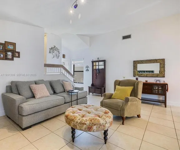 a living room with furniture and a couch