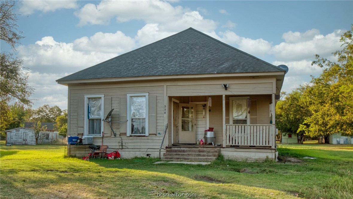 354 6th Street Somerville, TX 77879 - Photo 1 of 1 a view of a house with a yard