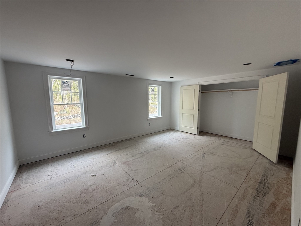120 Maple Street Stow, MA 01775 - Photo 34 of 36 a view of an empty room with a window